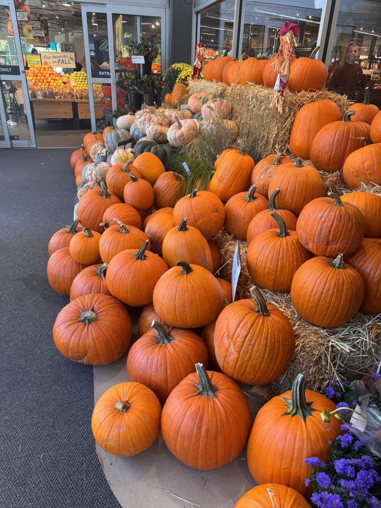 A fall display of pumpkins outside a Columbia City market