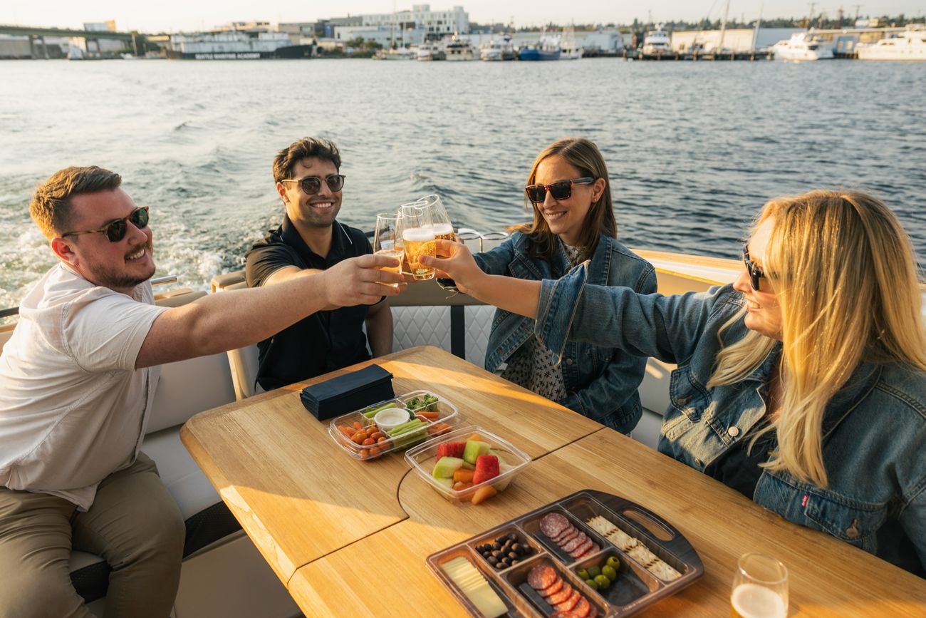 Friends raising a toast on a boat in Seattle