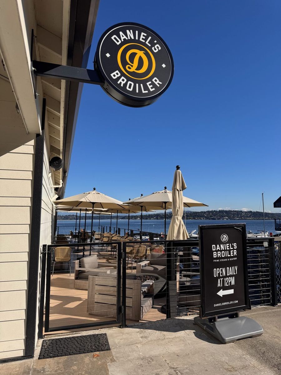 Daniel's Broiler sign and its patio overlooking the lake