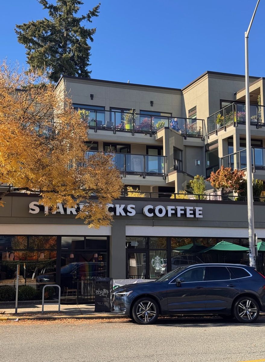 The Starbucks on the Leschi waterfront under a golden fall tree