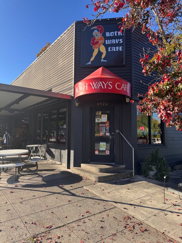 Both Ways Cafe's red awning and painted sign on a fall morning