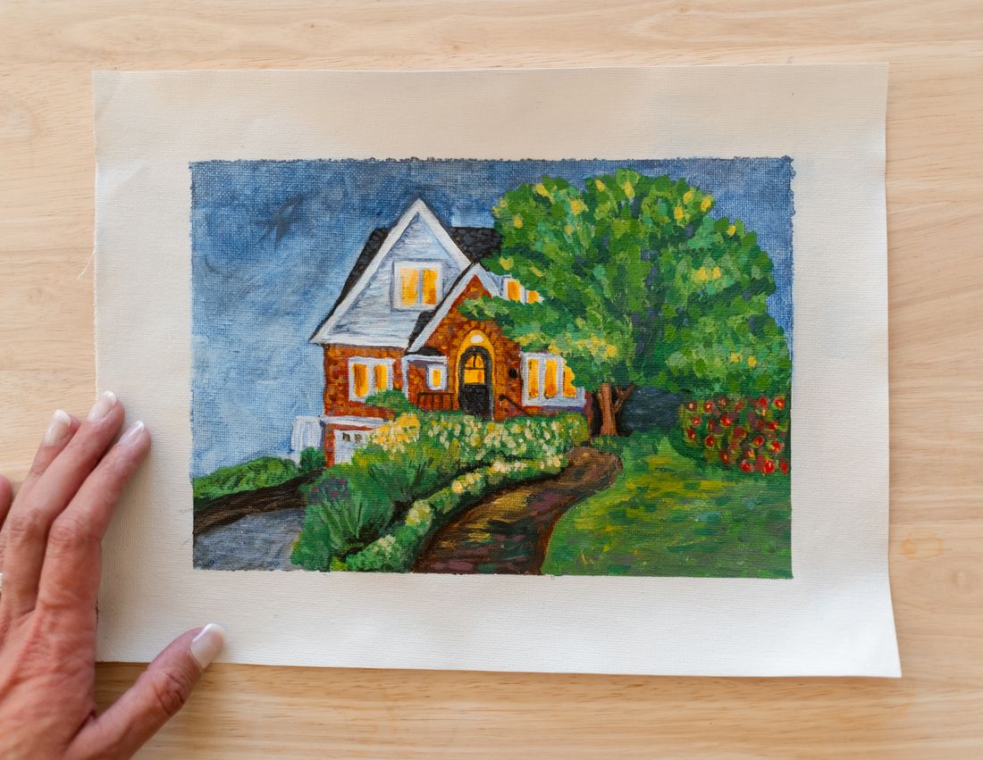 Watercolor painting of a brick house with a garden path